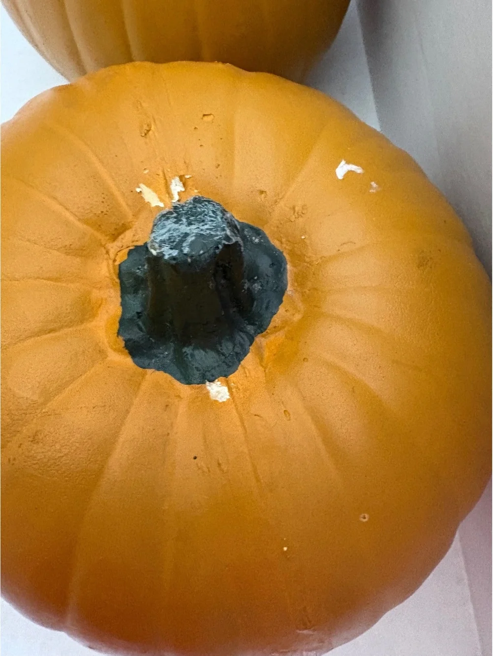 2 fake pumpkins